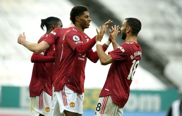 Marcus Rashford, centre, celebrates his goal at Newcastle