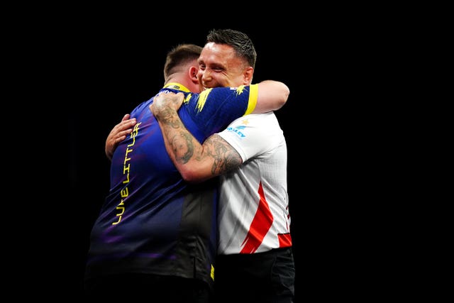 Gerwyn Price (right) hugs Luke Littler