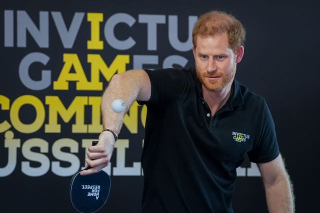 Harry plays table tennis at the Dusseldorf 2022 stand during the Invictus Games at Zuiderpark the Hague, Netherlands