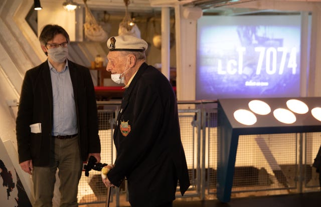 Veteran Bill Silvester is shown around the craft