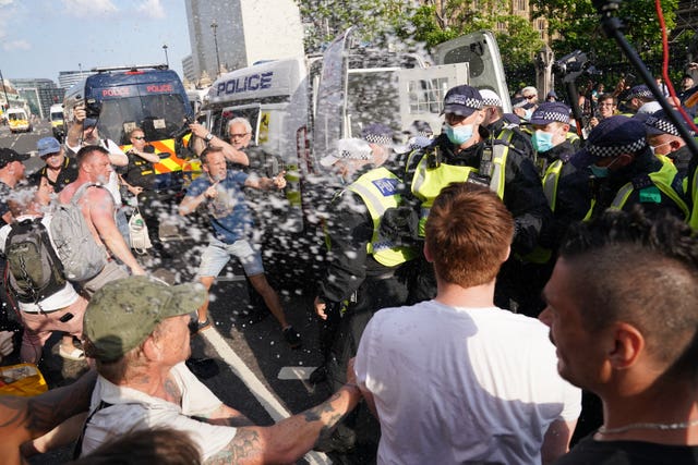 Police and protesters face each other in Parliament Square