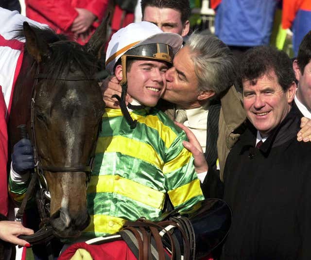 Trainer Francois Doumen kisses his son Thierry after Baracouda wins at Cheltenham