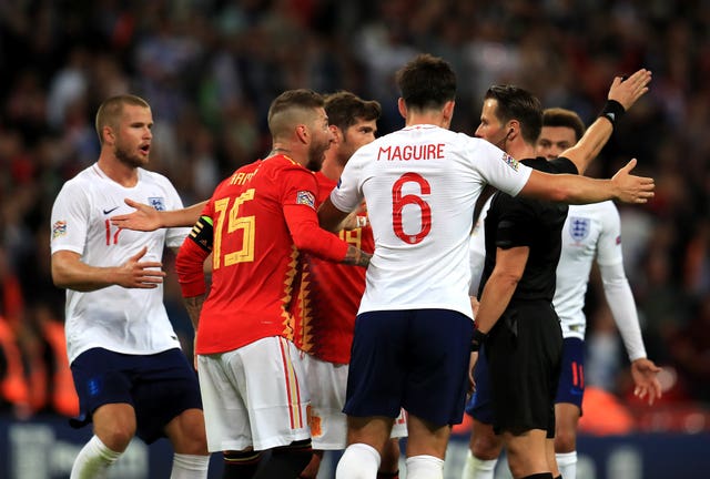 England players protest to the referee at Wembley.