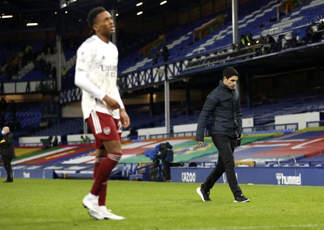 Mikel Arteta, right, leaves the field after defeat to Everton 