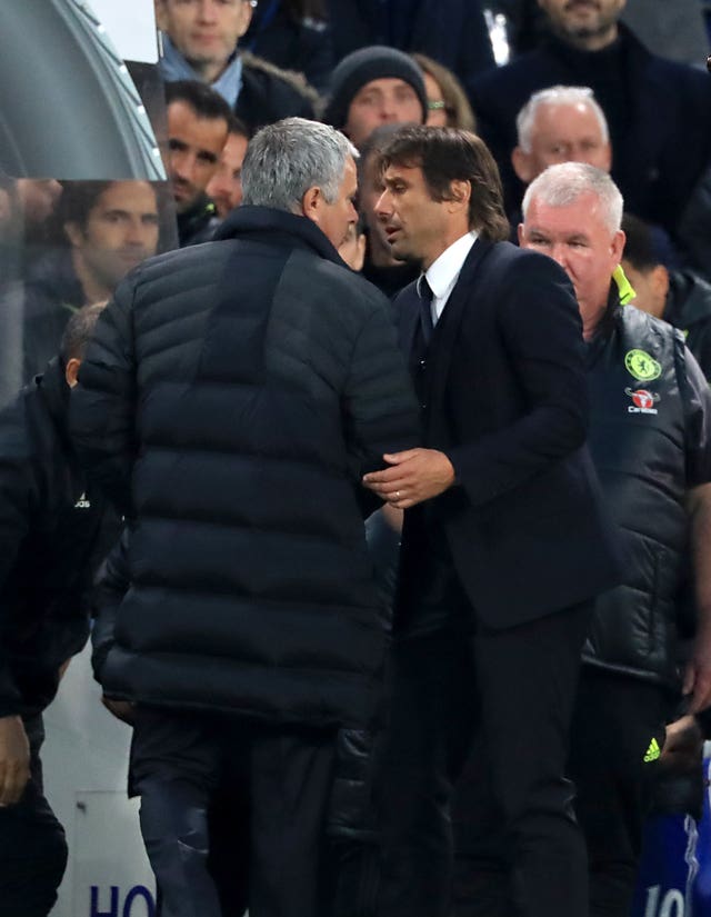 Manchester United boss Jose Mourinho and Chelsea head coach Antonio Conte exchange words at the final whistle