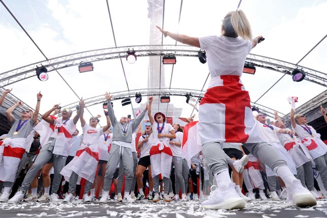 England players sing on stage