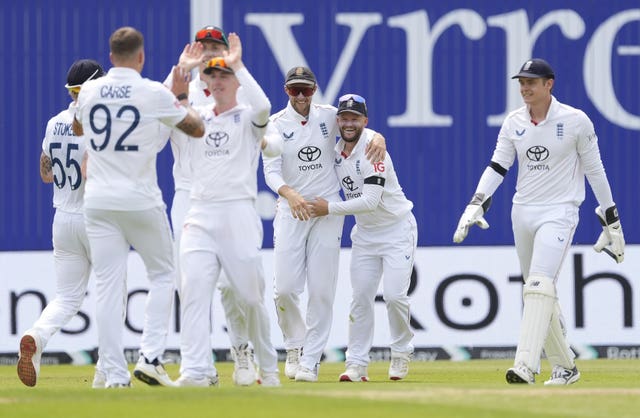 England celebrate Brydon Carse's wicket