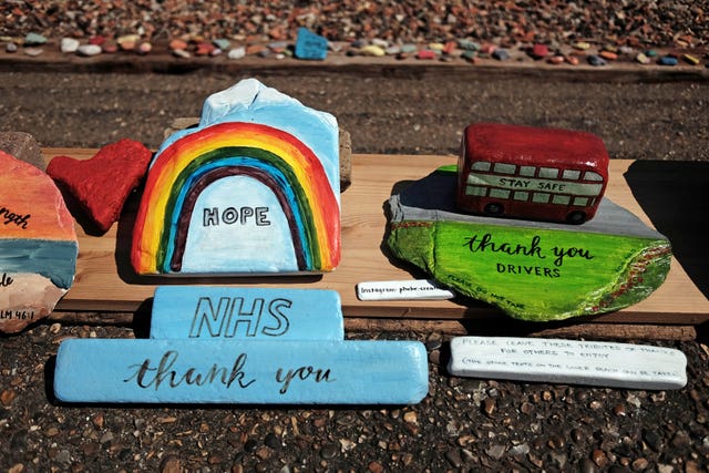 Tributes to NHS staff and bus drivers on display at Folly House Beach on the Isle of Dogs, east London