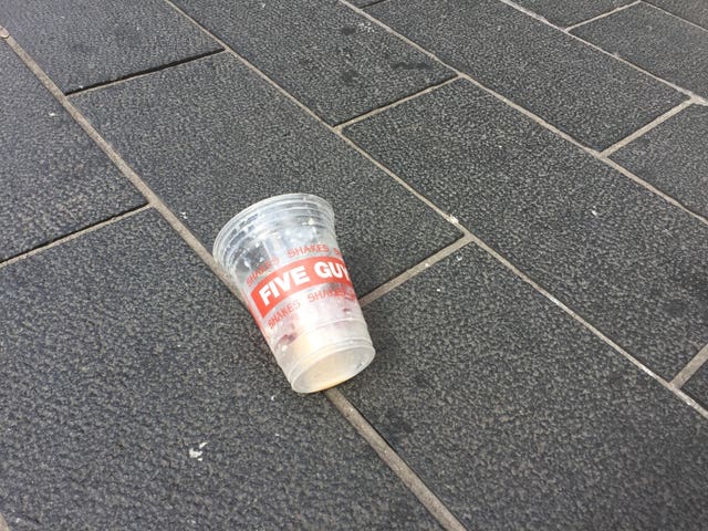 The empty milkshake cup  which is believed to have been emptied on Mr Farage (Tom Wilkinson/PA)