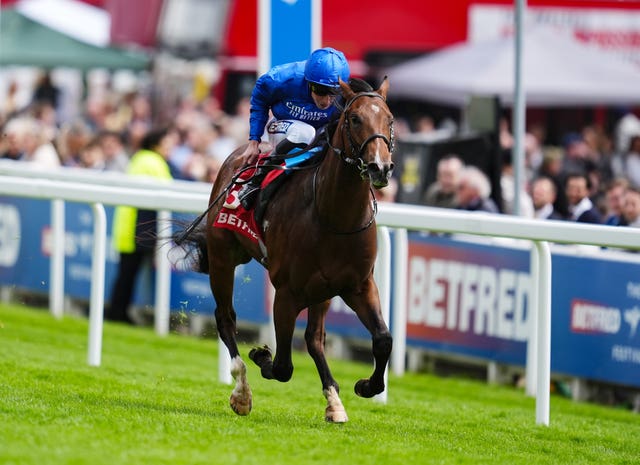 Maximized winning the Woodcote Stakes at Epsom