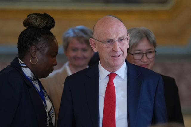 John Healey attends a press conference shortly before resigning as defence secretary