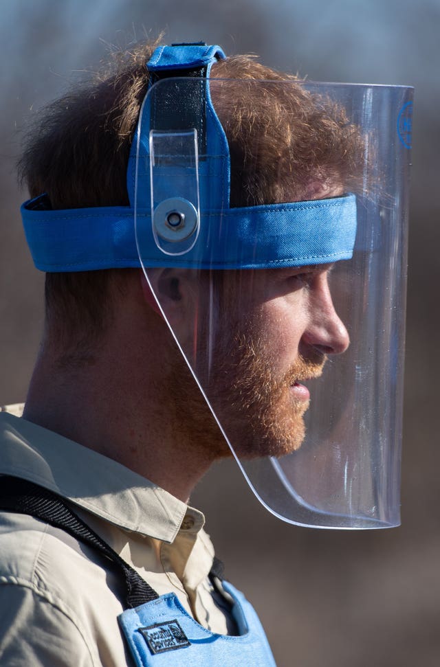 The Duke of Sussex walks through a minefield in Dirico, Angola