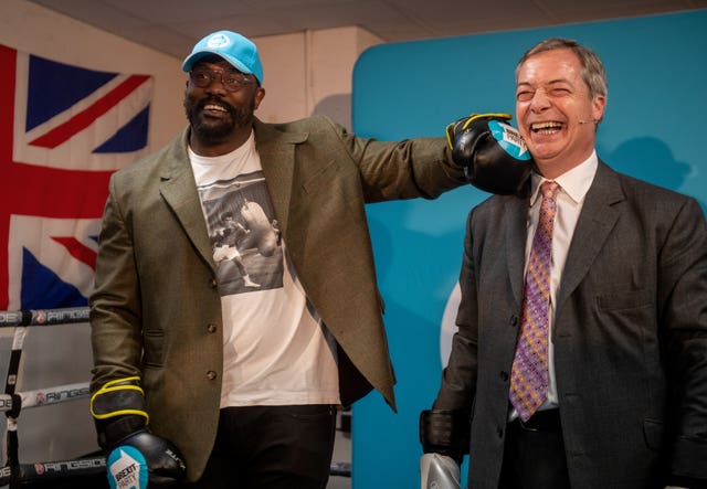 Heavyweight boxer Dereck Chisora with Brexit Party leader Nigel Farage at the Gator ABC Boxing Club in Hainault, Ilford, Essex