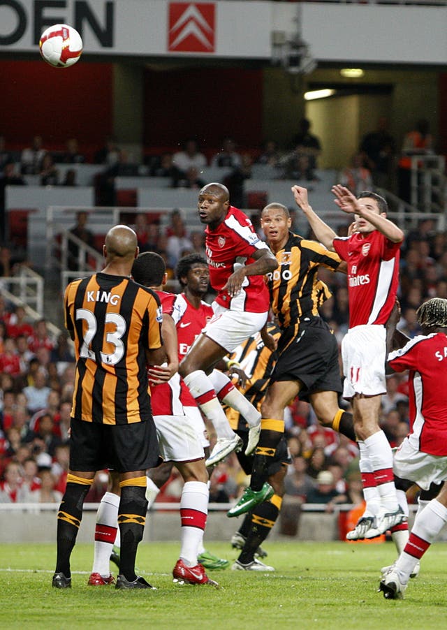 Daniel Cousin, centre, heads Gabon's first Premier League goal