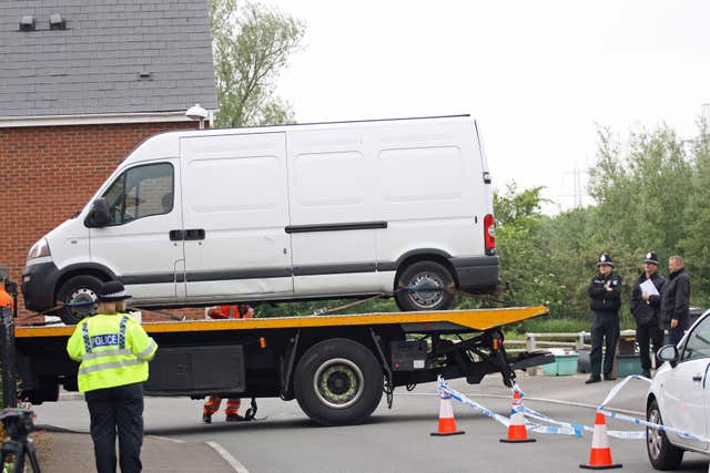 A white Vauxhall Movano van is taken away on a low loader (Rod Minchin/PA)