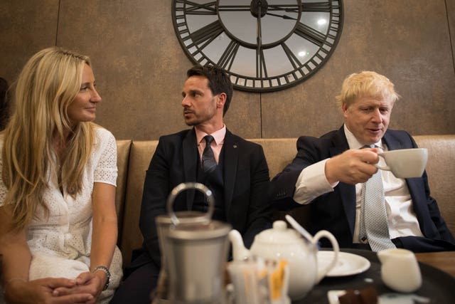 Mr Johnson interacts with local business people