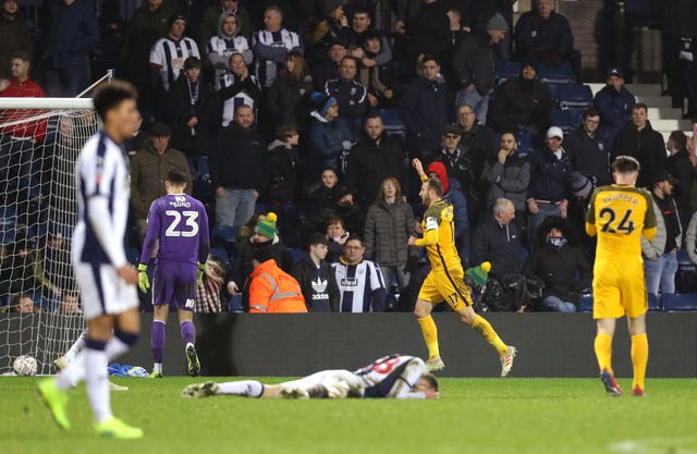 Glenn Murray celebrates his clinching third goal in front of West Brom fans