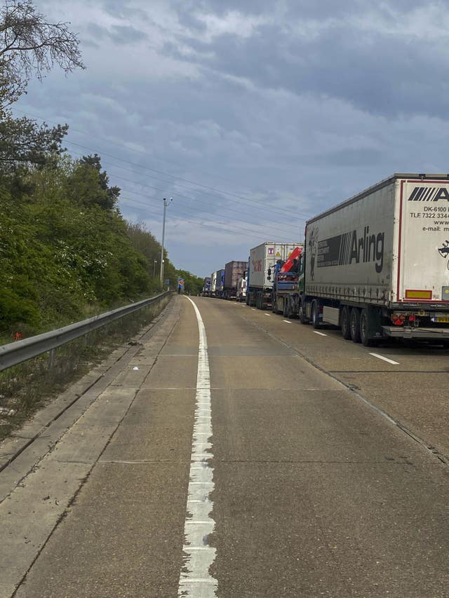 Vehicles stuck on the M25 motorway after an accident where cooking oil was spilt between junctions 24 and 25