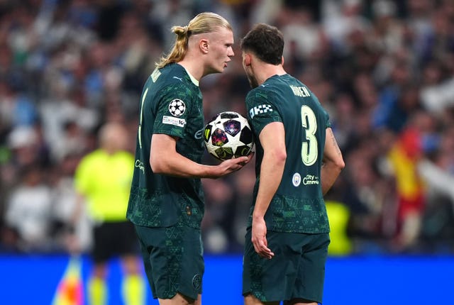 Erling Haaland, left, and Ruben Dias