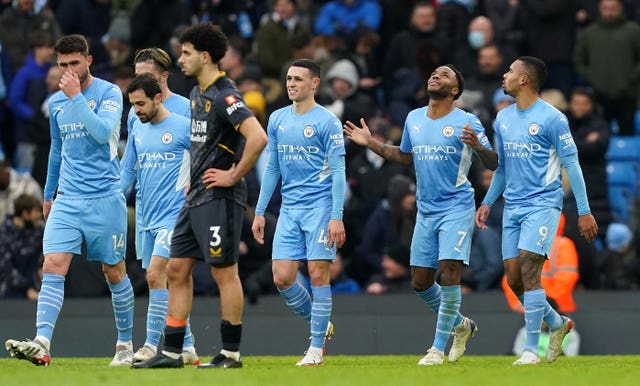 Raheem Sterling, second right, celebrates his 100th Premier League goal