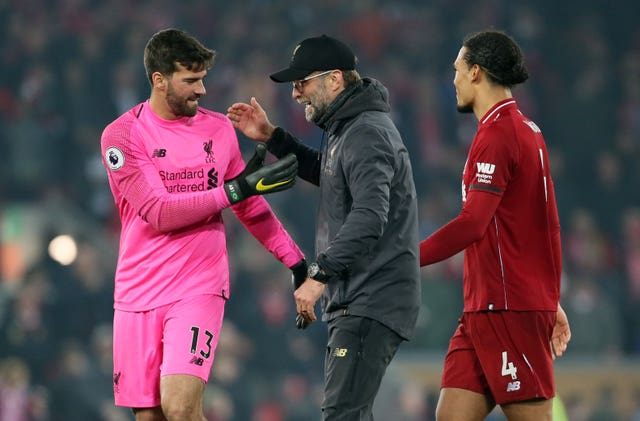 Liverpool are looking to tie Alisson, left, and Virgil Van Dijk, right, down to new contracts