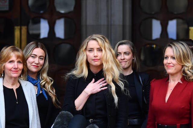 Amber Heard alongside her sister Whitney Henriquez (second right) and lawyer Jen Robinson (right), outside the High Court