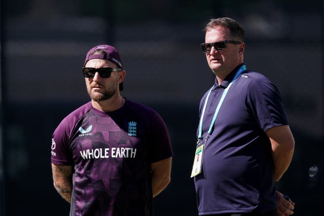 Brendon McCullum (left) and Rob Key (right) watch England train.