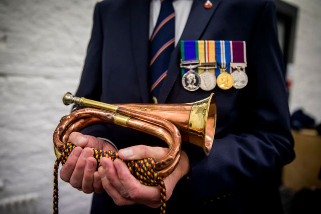 Man holds bugle