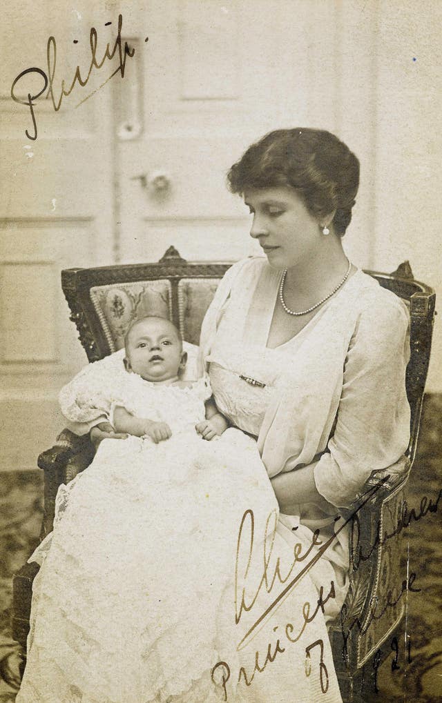 Prince Philip as a baby being held by Princess Alice