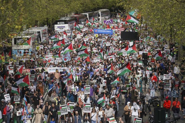 People take part in a pro-Palestine march in central London on April 13