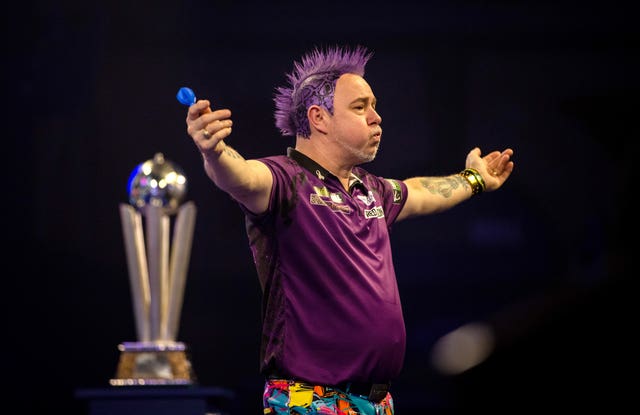 Peter Wright celebrates winning his first world title