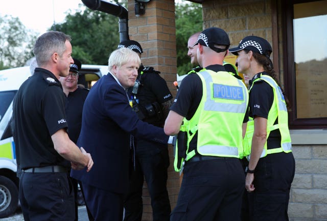 Prime Minister Boris Johnson meeting police officers (Yui Mok/PA)