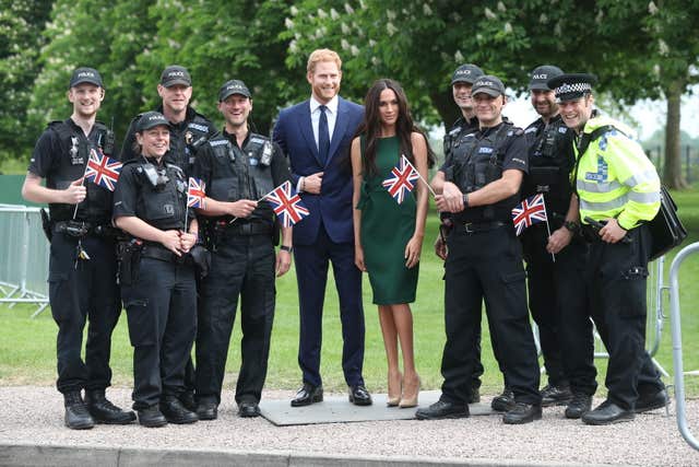 Police officers pose with the wax figures on the Long Walk in Windsor (Jonathan Brady/PA)