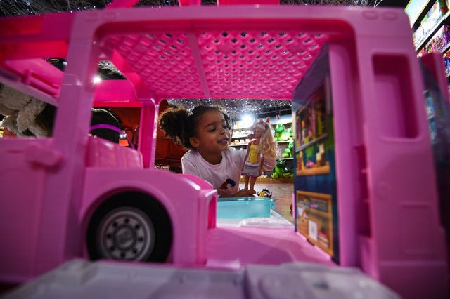 Layla, four, plays with a Barbie 3-in-1 Dream camper during the Hamleys Christmas toy showcase at Hamleys, Regent Street, London