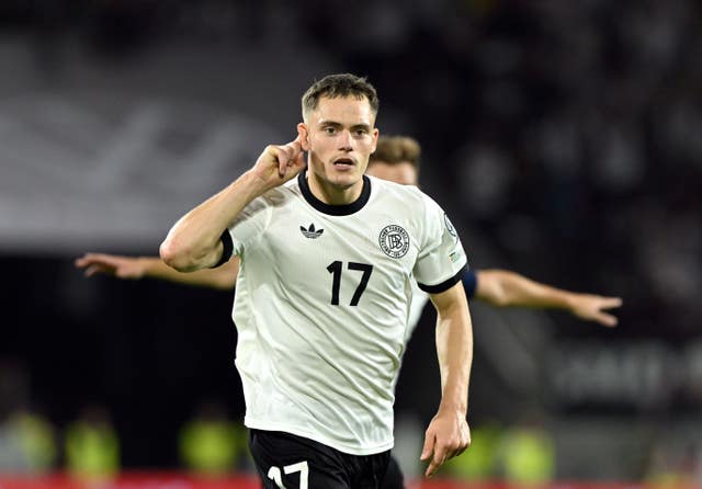 Florian Wirtz celebrates scoring Germany's third