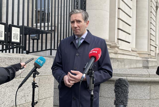 Tanaiste Simon Harris speaks to reporters outside Government Buildings in Dublin