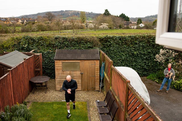 James Campbell, 32, celebrated his birthday while running a 26.2-mile marathon course in his garden (Jacob King/PA).