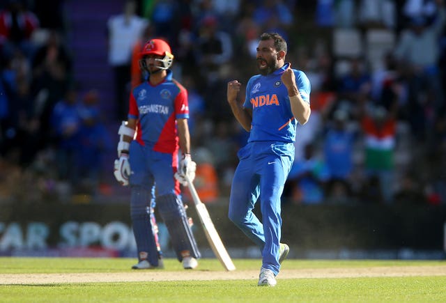 Mohammed Shami, right, took a hat-trick against Afghanistan (Nigel French/PA)