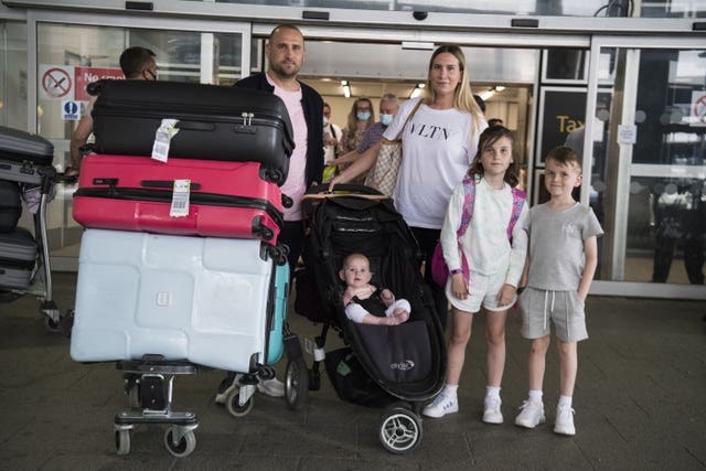 Paul and Jemma Nevard and their children at Gatwick