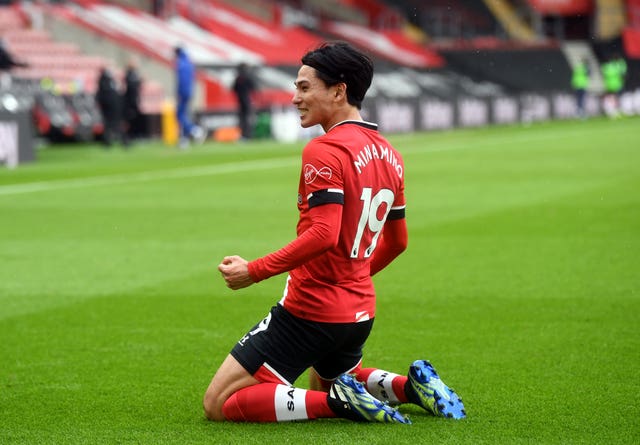 Takumi Minamino celebrates scoring Southampton's opening goal against Chelsea.