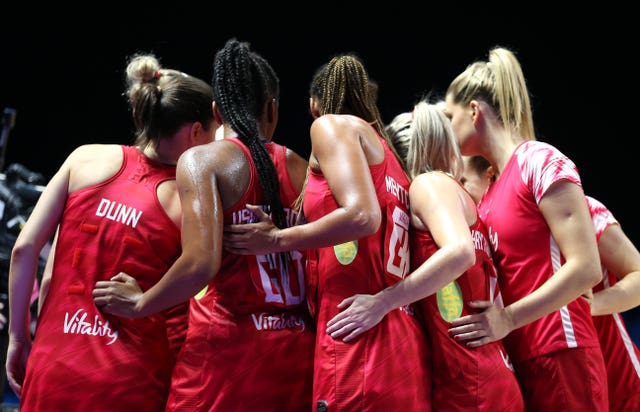 England's players huddle prior to their bronze medal clash with South Africa