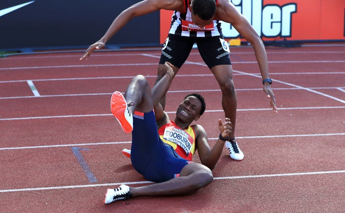 Ojie Edoburun is congratulated by Zharnel Hughes, top