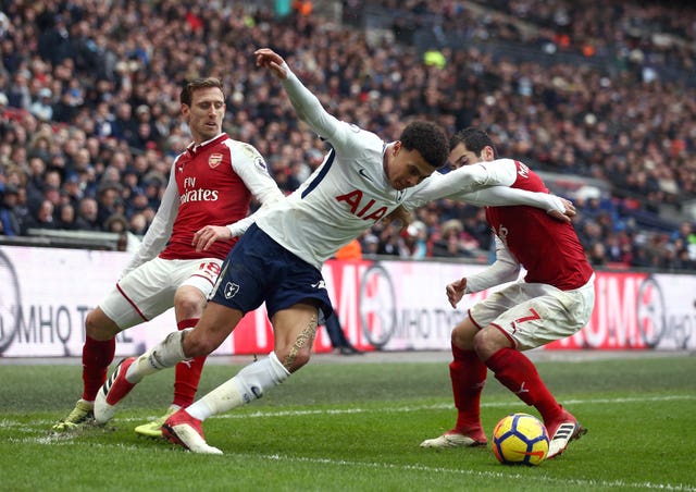 Dele Alli (centre) had a much better afternoon than Henrikh Mkhitaryan (right) 