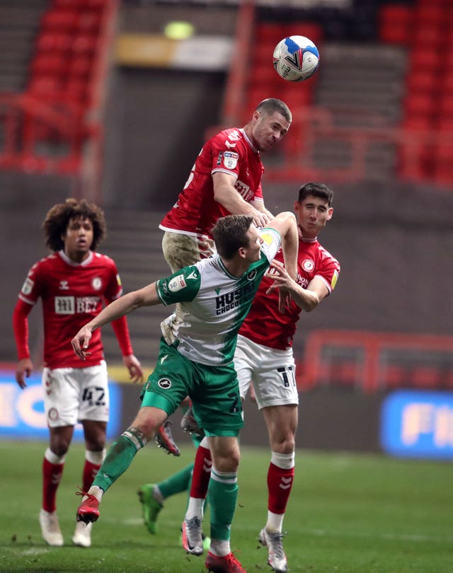 Bristol City’s Tommy Rowe rises highest to win a header during his side's Championship match against Millwall