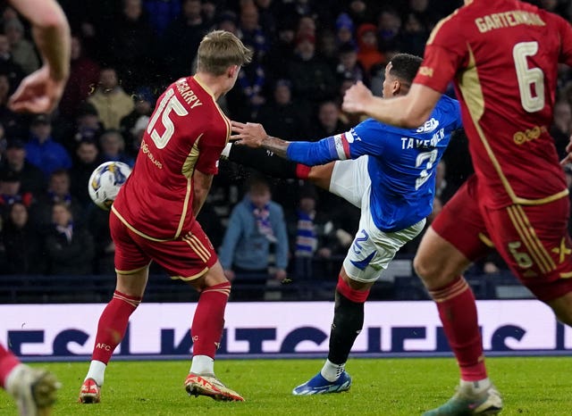 James Tavernier, centre, scores Rangers’ winner
