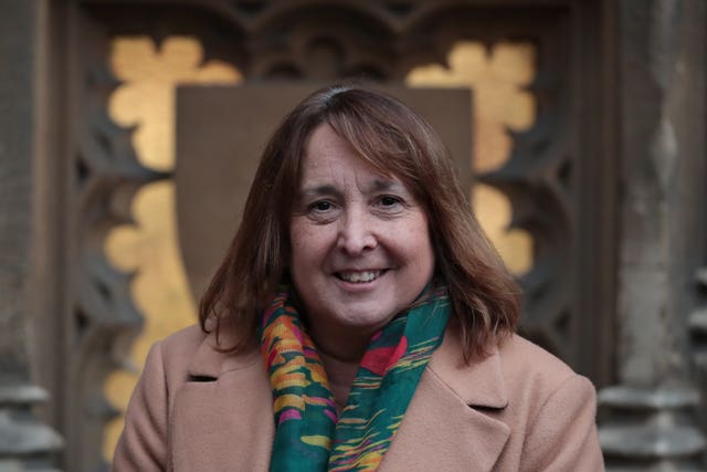 Christine Jardine smiling to camera, at the Houses of Parliament