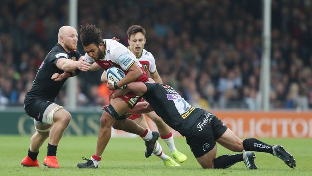 Northampton's Lewis Ludlam is tackled by Exeter's Jack Yeandle