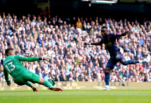 Manchester City goalkeeper Zack Steffen saves a shot from Burnley’s Maxwel Cornet