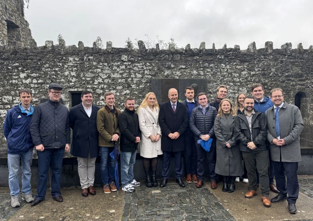 Taoiseach Micheal Martin Annual with a group of poeple at the Fianna Fail Wolfe Tone Commemoration