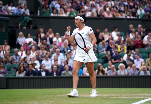 A packed house looks on as Ons Jabeur gestures during her Ladies' singles match against Aryna Sabalenka